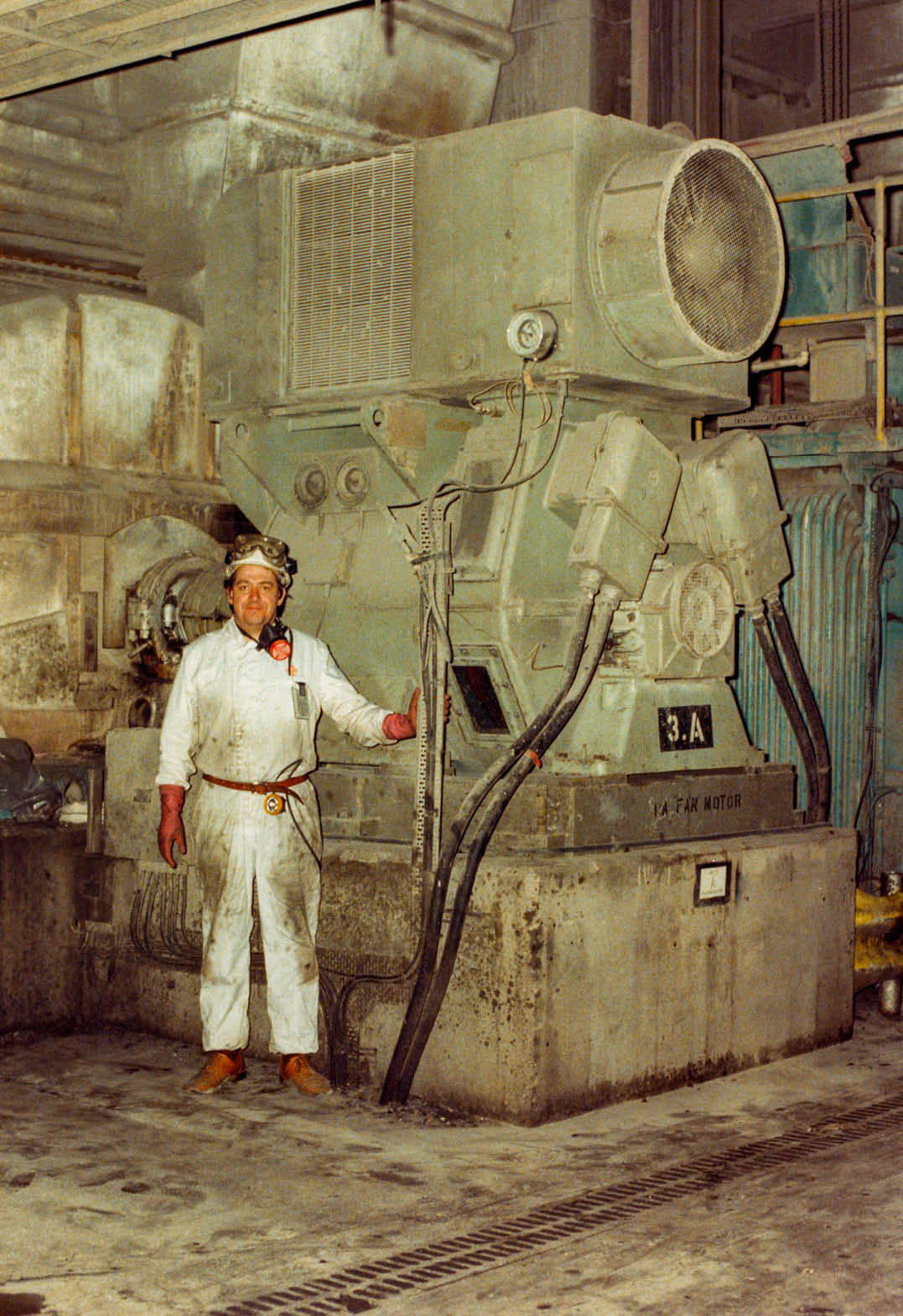John Hurst - Electrical Engineer standing next to original PA fan induction regulator motor circa early 1980s.